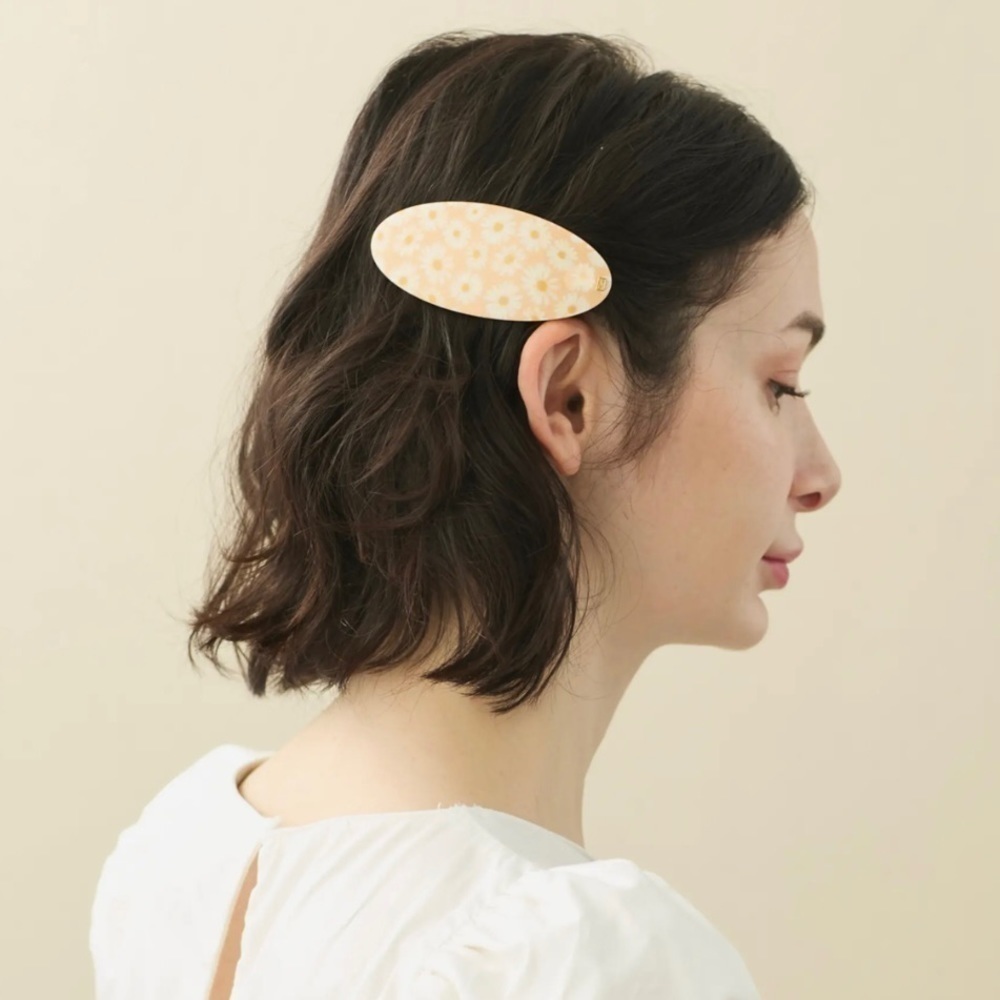 ALEXANDRE DE PARIS  DAISY OVAL BARRETTE  IN ORANGE $78